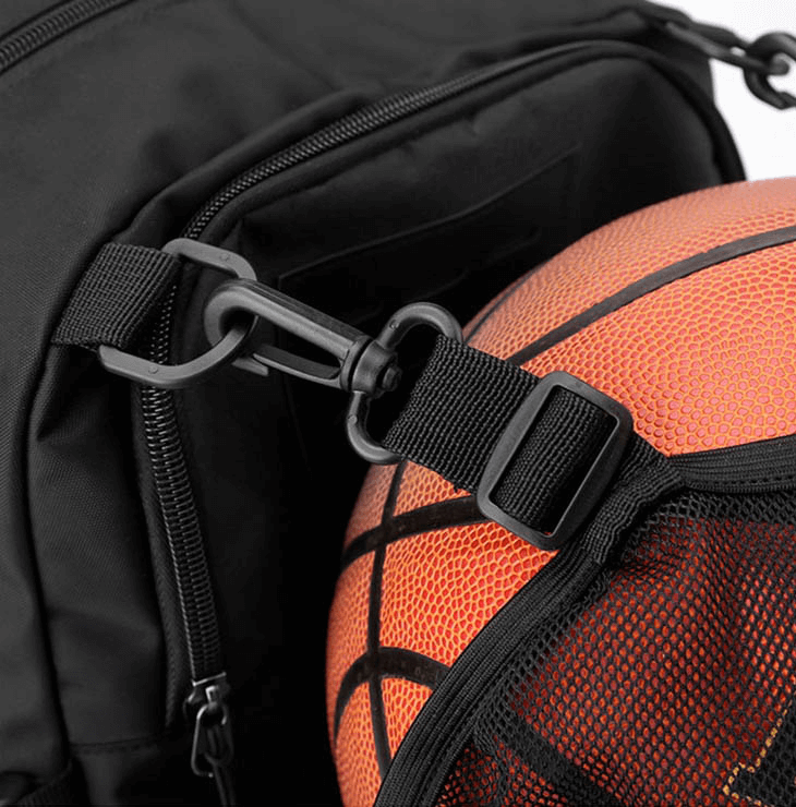 Close-up of sports backpack with detachable net pocket holding a basketball, featuring a secure buckle and durable material.
